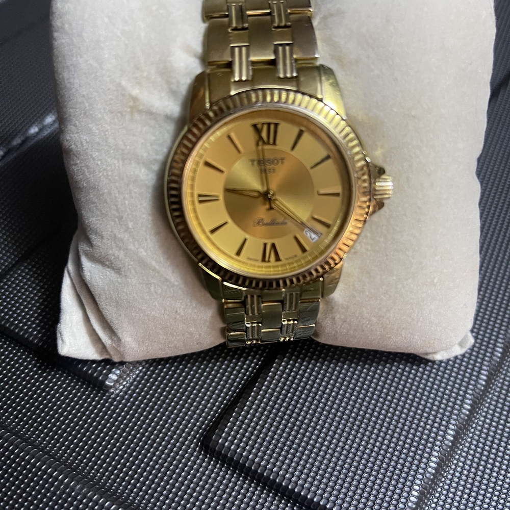 Tissot Gold Tone Watch with Roman Numerals